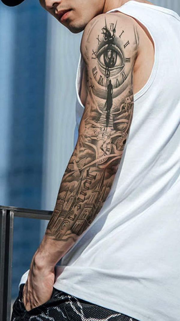 Tattoo design on a person's arm with a detailed clock and eye illustration, next to a full sleeve tattoo design.